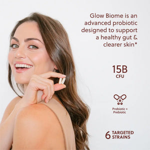 Image of women holdling up glow biome probiotic capsules